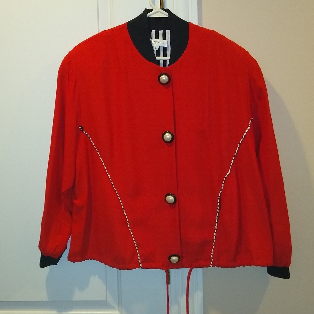 Red jacket with string tie at the bottom